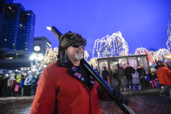 Ash of Lino Lakes took his torch past Rice Park during  the Winter Carnival Torchlight Parade, on Fifth Street in downtown St. Paul on Saturday, Feb. 6, 2016. (Special to the Pioneer Press: Craig Lassig)
