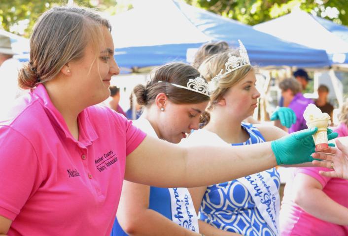 From left, Meeker County dairy ambassador Natalie Barka and dairy princesses Rachel Turck and Ashley Warren dished out ice cream cones during Ice Cream in the Park last year.