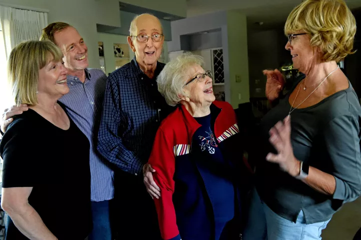 Bob and Yvonne Momsen, center, share memories with three of their kids, from left, Beverly Momsen, Brad Momsen and Bonnie Brill, at their Mendota Heights home on Friday, Sept. 7, 2018. The couple will celebrate their 70th wedding anniversary on Sept. 11, 2018. (Jean Pieri / Pioneer Press)