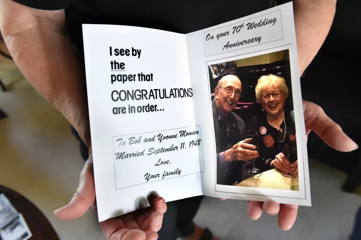 Beverly Momsen shows a card that was made for her parents, Bob and Yvonne Momsen, at their Mendota Heights home on Friday, Sept. 7, 2018. They will celebrate their 70th wedding anniversary on Sept. 11, 2018. (Jean Pieri / Pioneer Press)