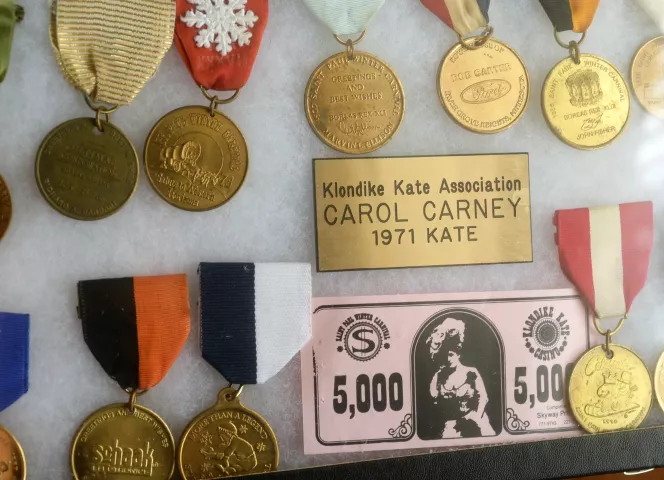 Carol Carney was the St. Paul Winter Carnival's first Klondike Kate in 1971. Her many winter carnival medallions and buttons are on display in glass cases. (Scott Takushi / Pioneer Press)