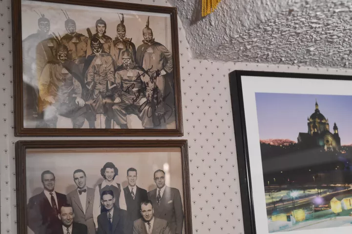 Kitty Ryan, the first and only woman Vulcan, stands (top row, center) with the 1952 Krewe in this pair of autographed photos, hanging in the personal collection of former Vulcanus Rex Tom Barrett on Jan. 12, 2022. In 2026, Ryan was crowned Princess of the Four Winds in the Carnival's Senior Royalty. (Scott Takushi / Pioneer Press)
