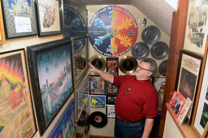 Tom Barrett shows off some of his Winter Carnival memorabilia displayed in the basement stairway of his home on Wednesday, Jan. 12, 2022. (Scott Takushi / Pioneer Press)