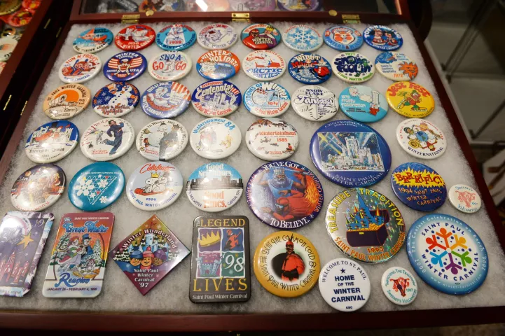 Winter Carnival buttons are among the Winter Carnvial memorabilia in the collection of Tom Barrett, displayed in the basement of his home on Wednesday, Jan. 12, 2022. (Scott Takushi / Pioneer Press)