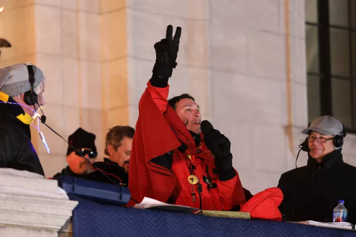Marking the end to the the Vulcan Victory Torchlight Parade, Vulcans unmask and raise their “V” sign to signify the end of winter Saturday, Feb. 5, 2022. (Hannah Hobus / Pioneer Press)